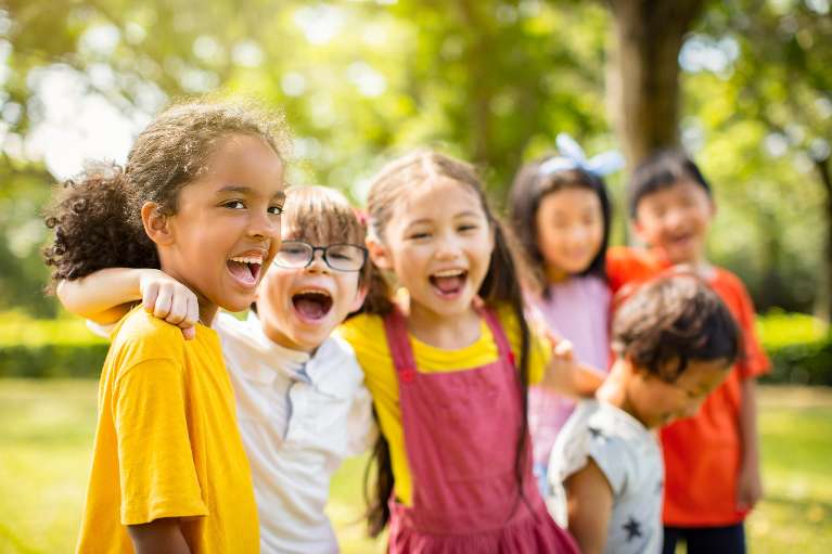 A group of children smiling after visiting a dentist in Pacifica, CA
